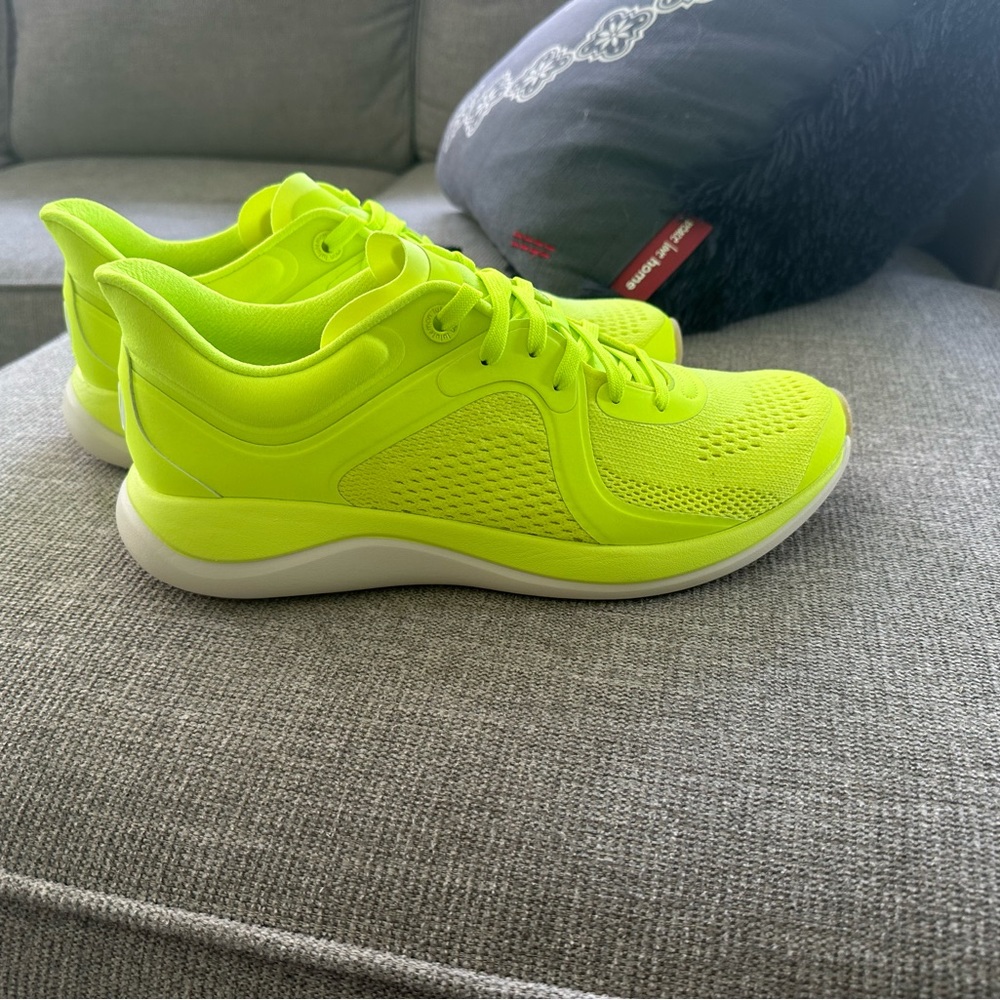 Never women Lululemon women’s shoes.  They are a vibrant yellowish color.